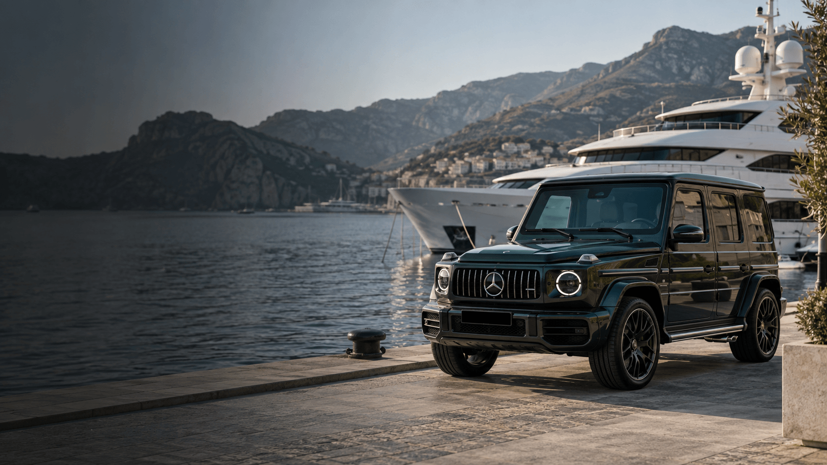 Mercedes G-Class beside a yacht at a marina