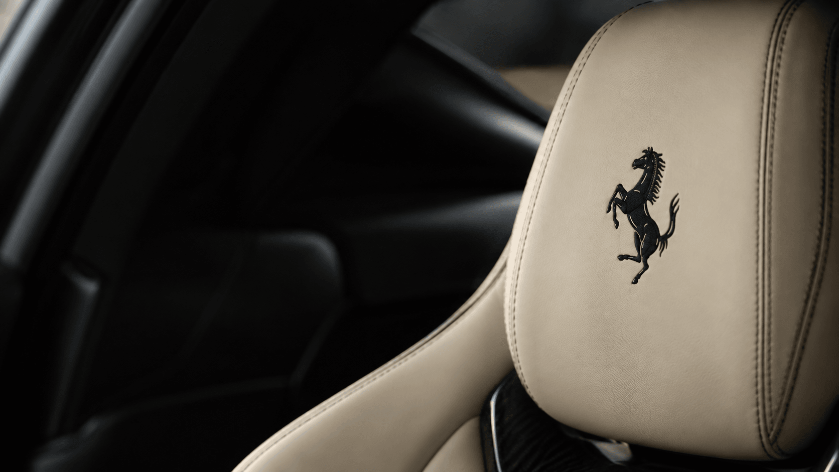 Prancing horse embroidered on a cream Ferrari headrest